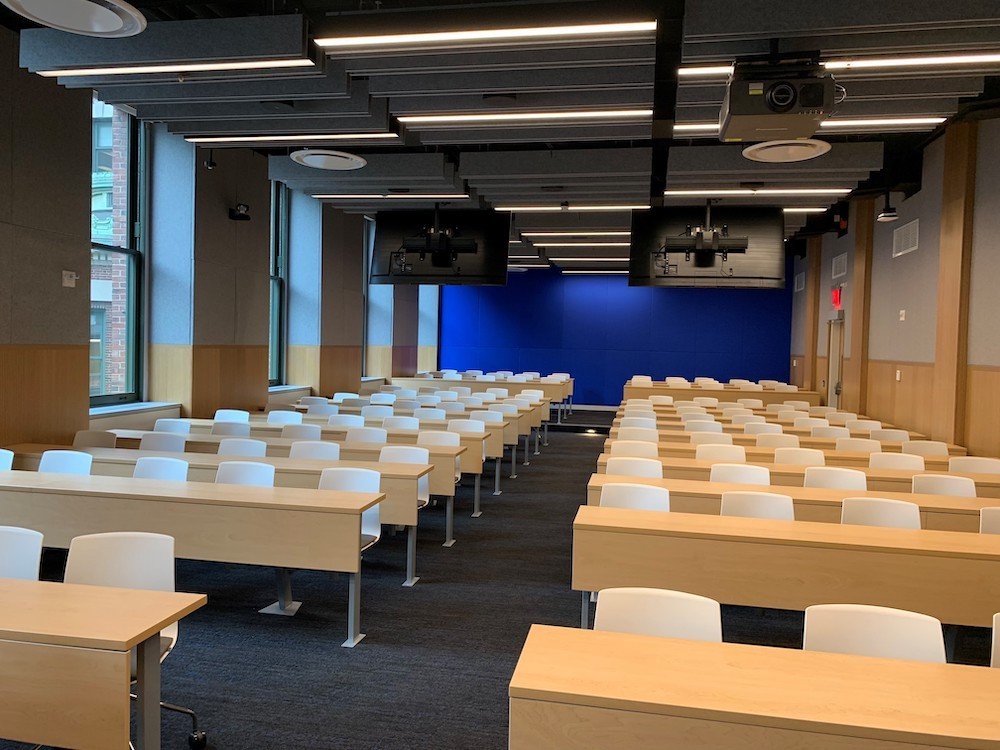 Two columns of desks with five chairs each